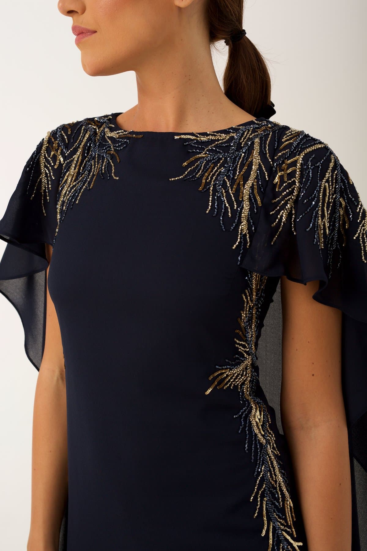  elegant cocktail dress features sublet embroidery on the shoulders and on the sides of the waist 