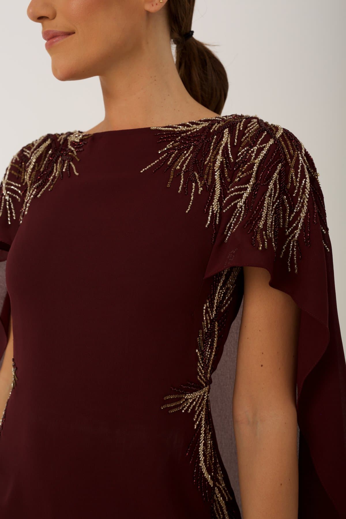  cocktail dress features sublet embroidery on the shoulders and on the sides of the waist