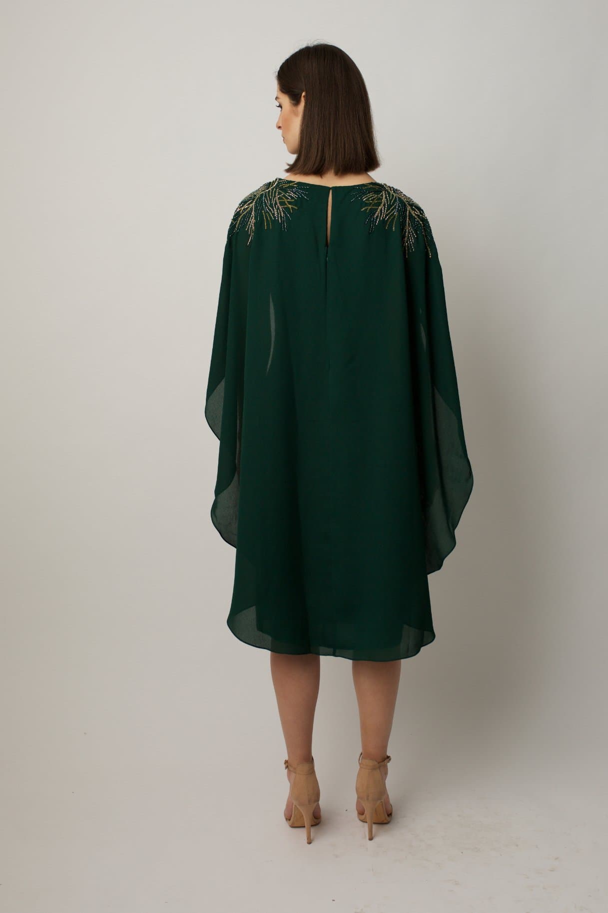  cocktail dress features sublet embroidery on the shoulders and on the sides of the waist