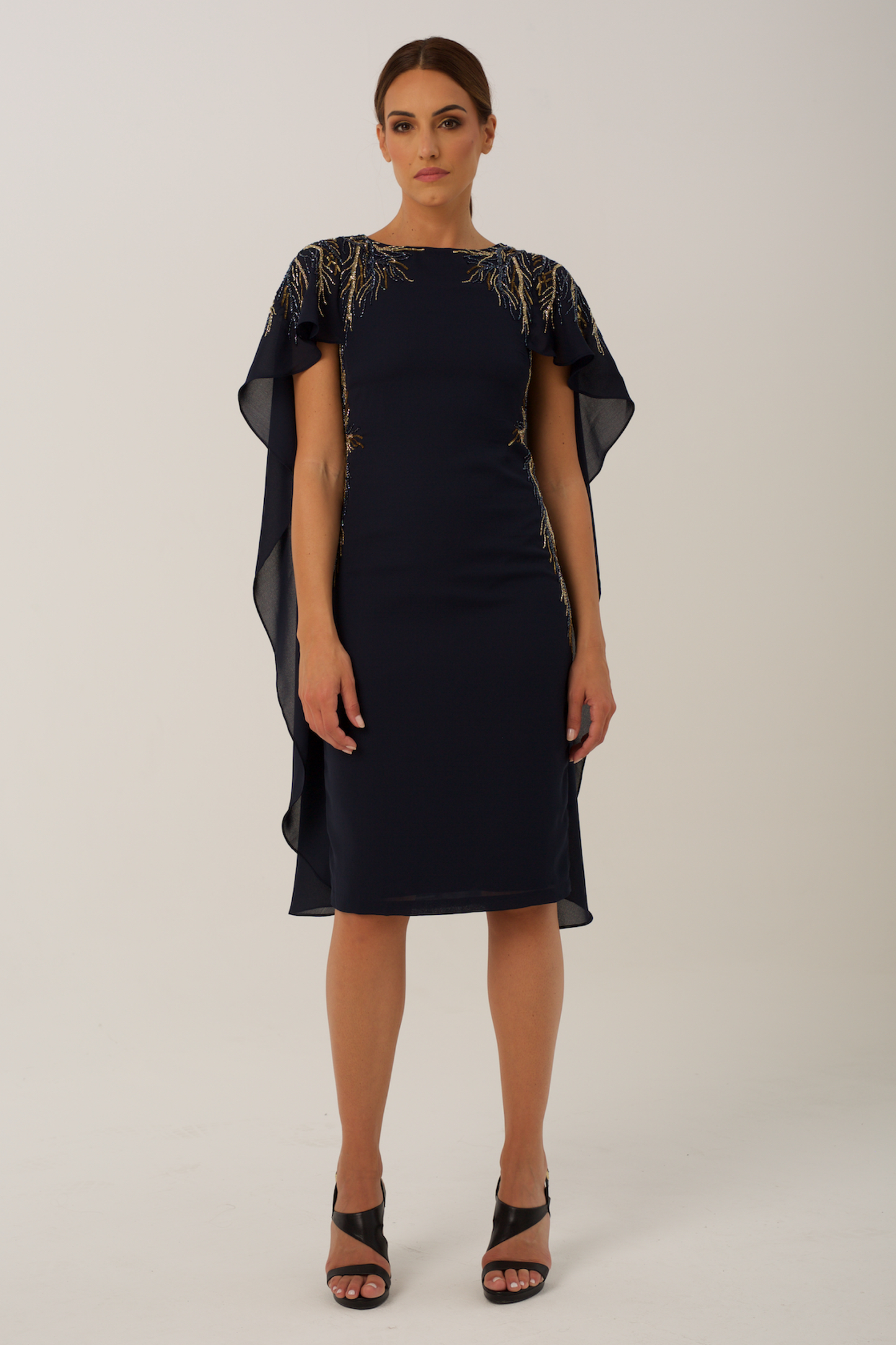  elegant cocktail dress features sublet embroidery on the shoulders and on the sides of the waist 