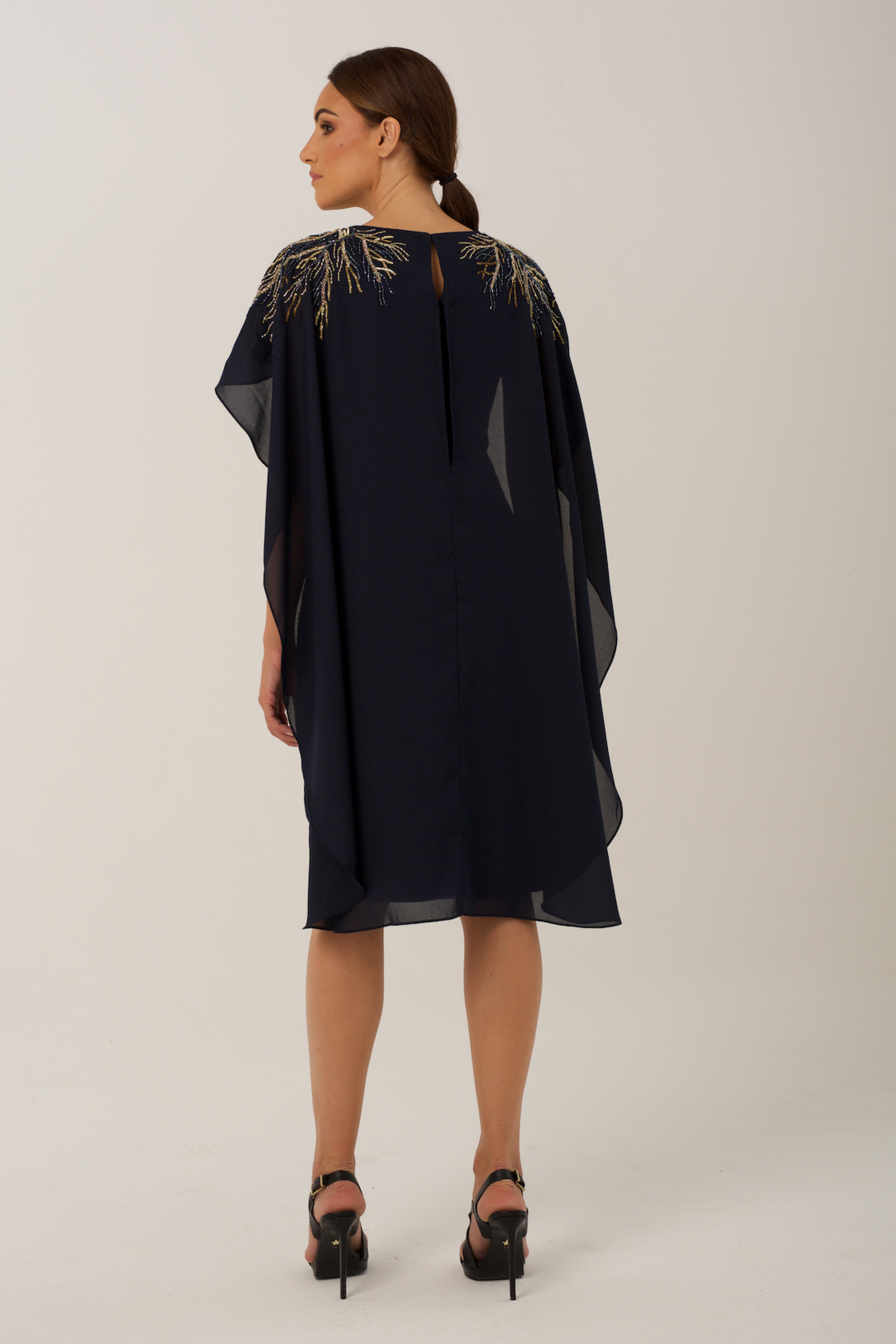  elegant cocktail dress features sublet embroidery on the shoulders and on the sides of the waist 