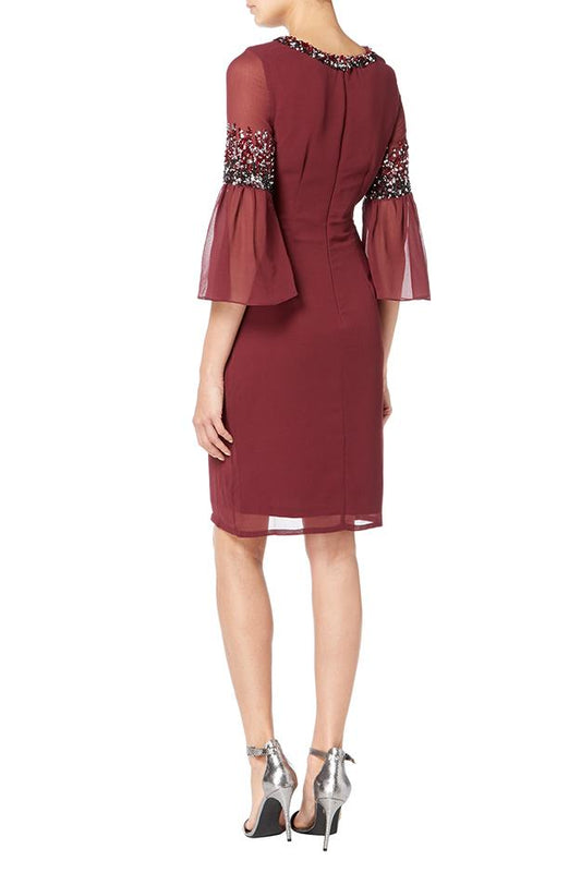 wine coloured midi dress with embellishment at the neckline and arms.